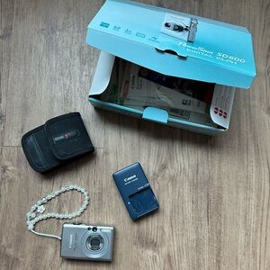 Canon PowerShot ELPH digital camera with Black Case, Charm, and Charger